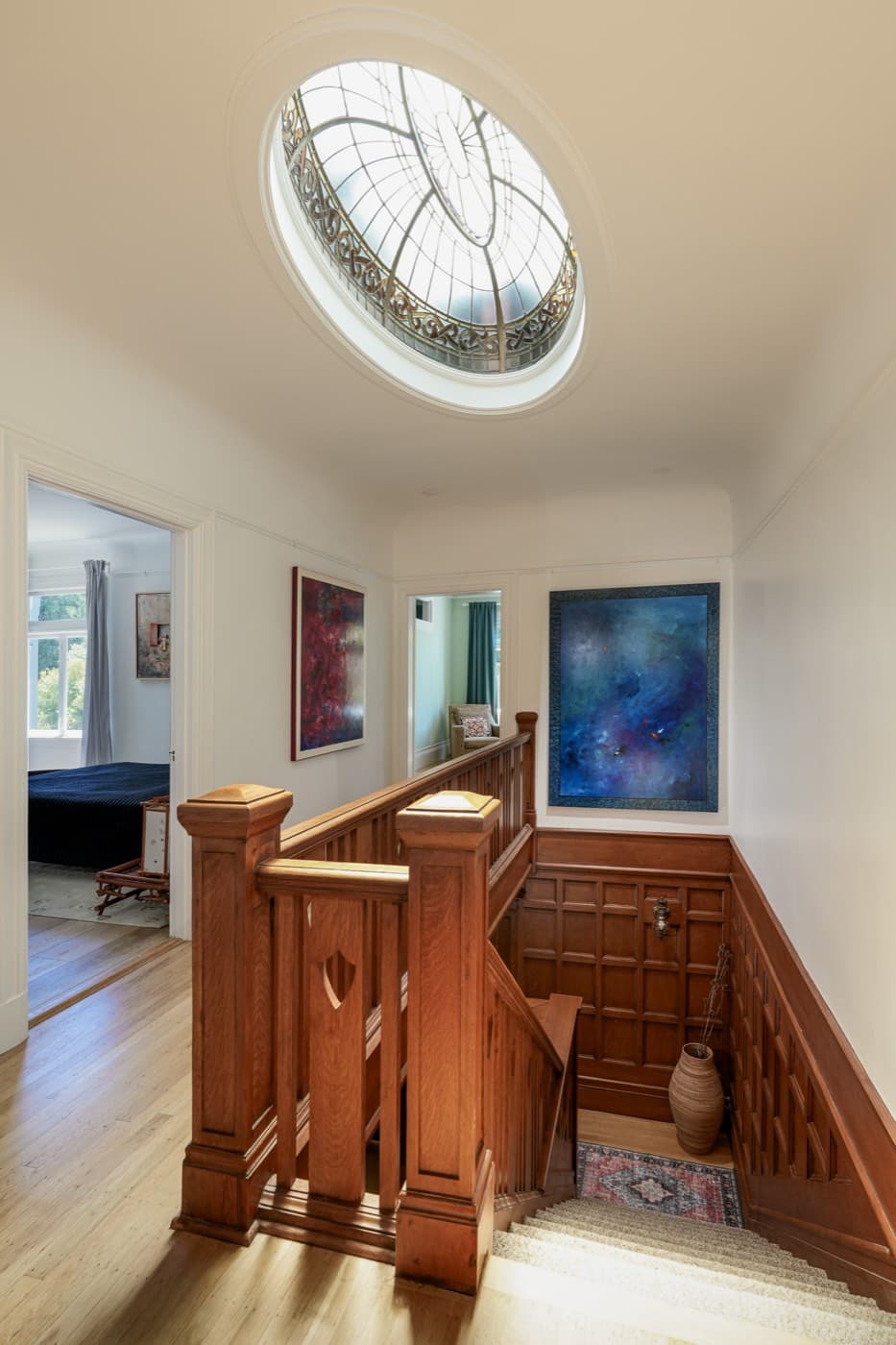 The same staircase with the original wood stripped back and refinished