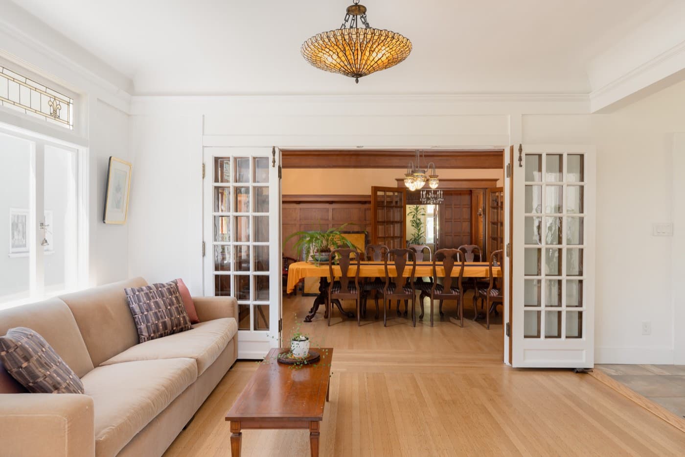 The dining room seen from the living room, through the open french doors
