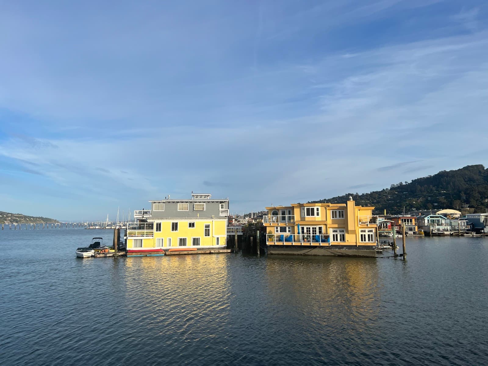 Sausalito floating homes on the water with the Marin hills behind at golden hour