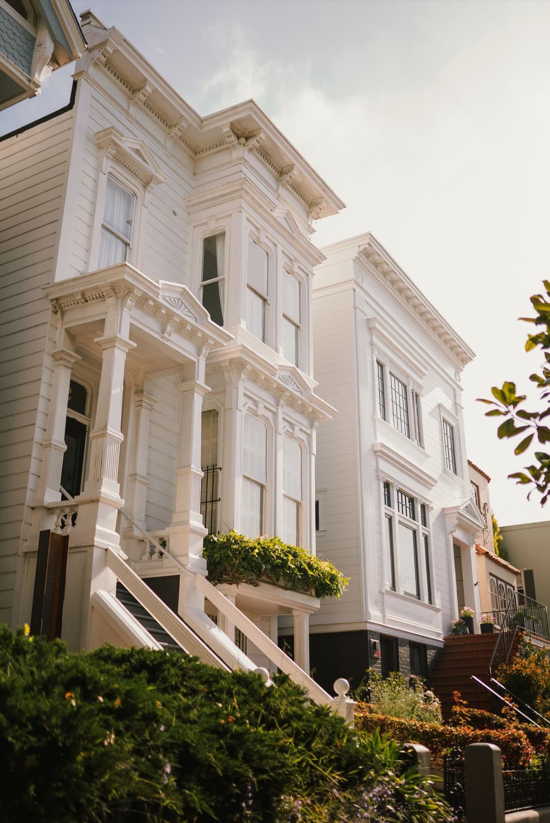 A pair of crisp white Victorian homes in San Francisco